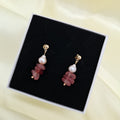 Add a vibrant touch of Filipino craftsmanship to your collection with these unique statement earrings. Combining natural pink gemstone chips with lustrous freshwater pearls on polished gold ball studs, these dangles are 100% handcrafted in the Philippines by local artisans. Made with premium non-tarnish materials, they are built to maintain their brilliant shine and beauty over time.