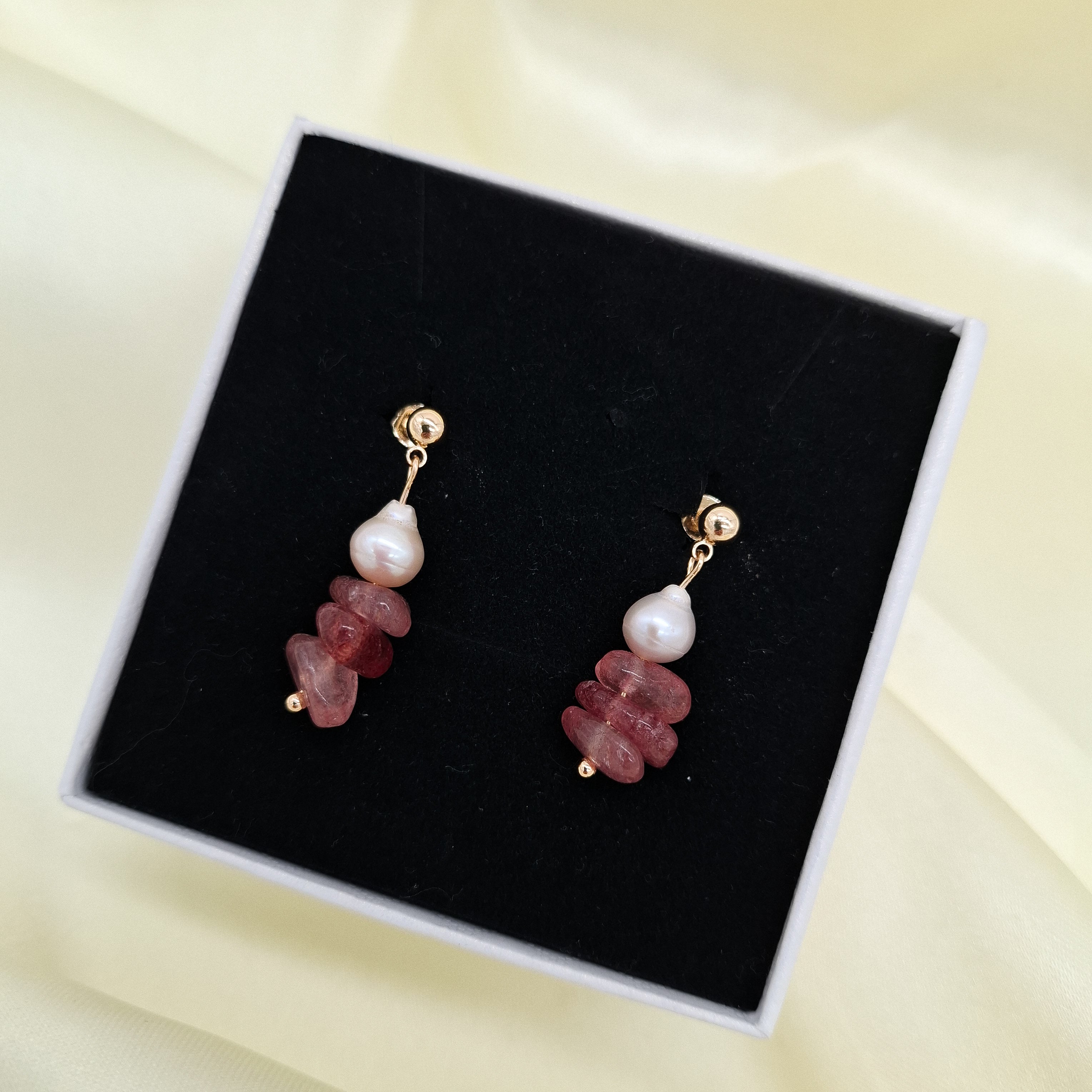 Add a vibrant touch of Filipino craftsmanship to your collection with these unique statement earrings. Combining natural pink gemstone chips with lustrous freshwater pearls on polished gold ball studs, these dangles are 100% handcrafted in the Philippines by local artisans. Made with premium non-tarnish materials, they are built to maintain their brilliant shine and beauty over time.